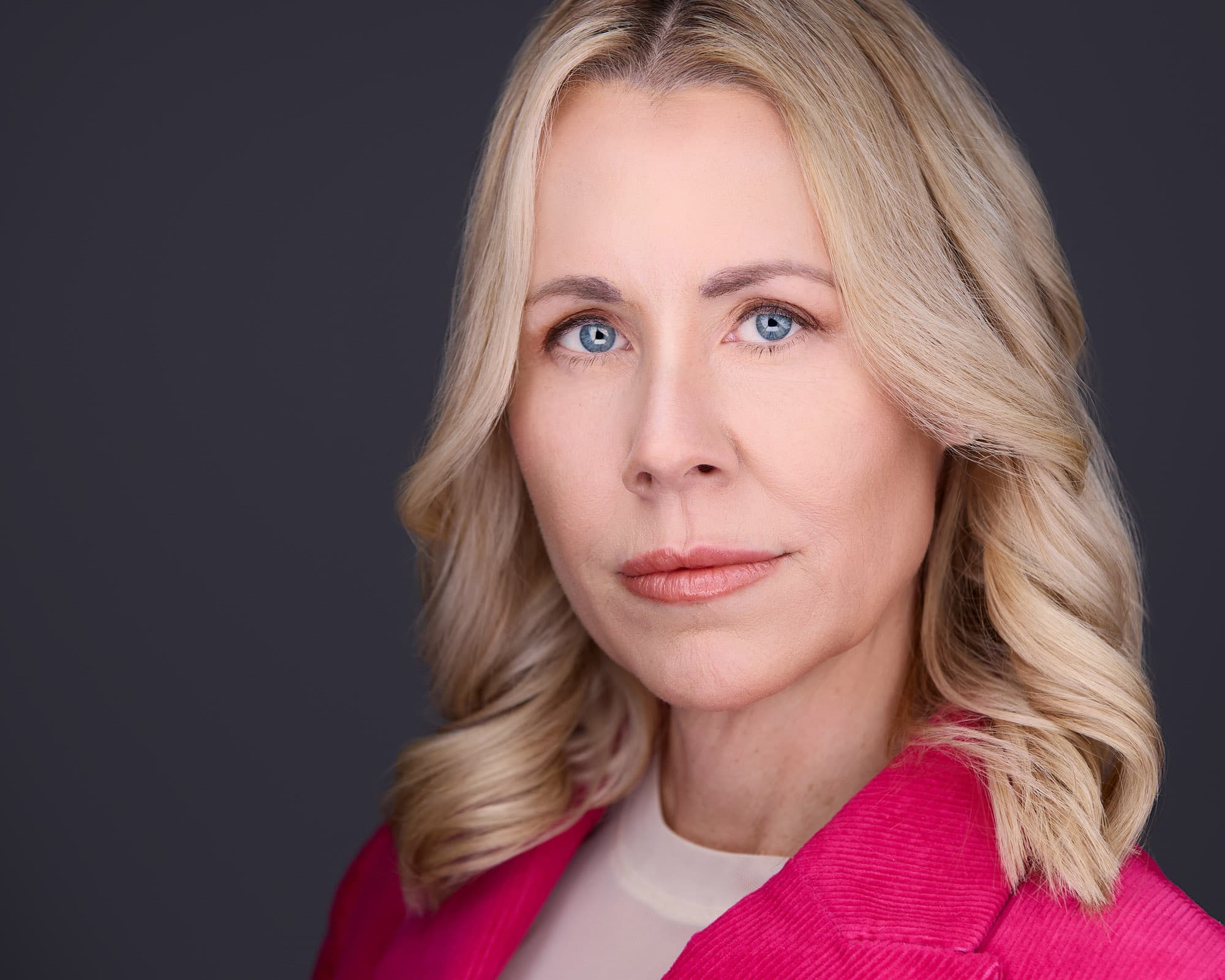 Headshots for women - bold pink blazer creative industry style
