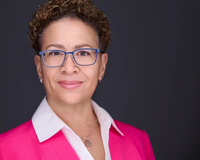 Business headshot of female professional with natural lighting