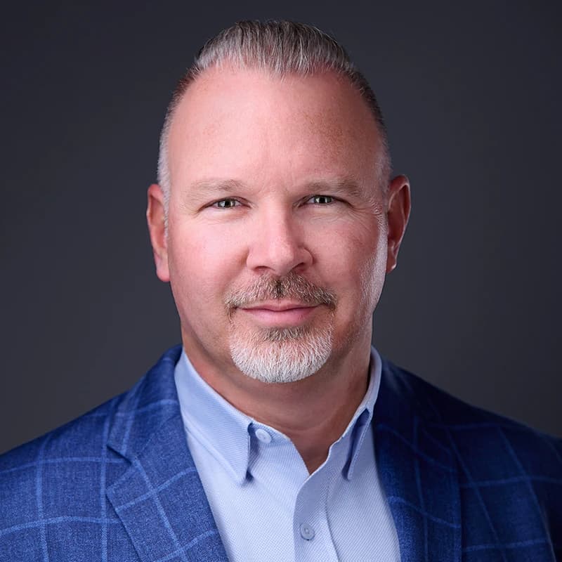 Professional headshot wearing Blue