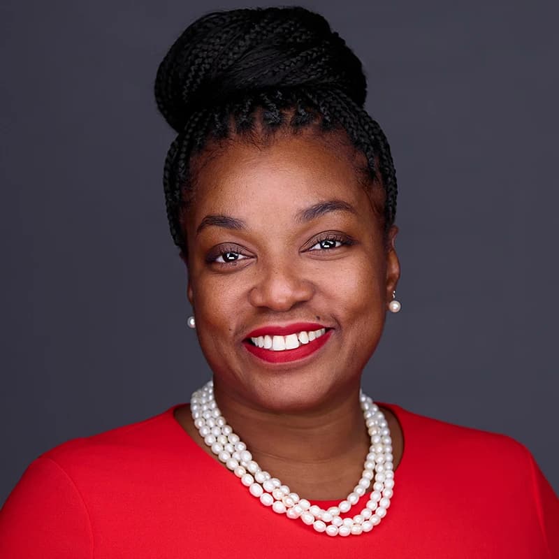 Professional headshot wearing Red