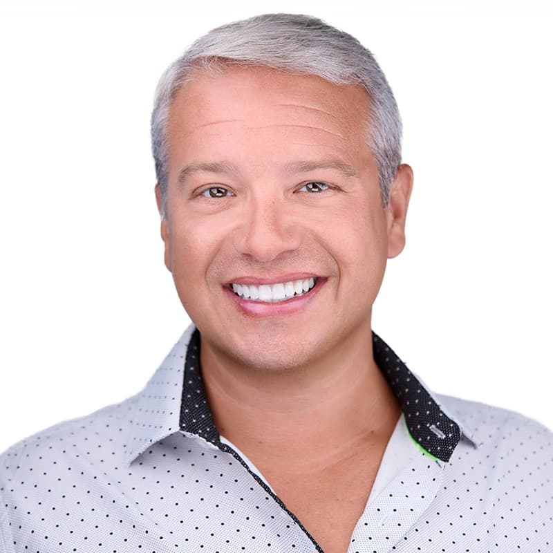 Professional headshot wearing White