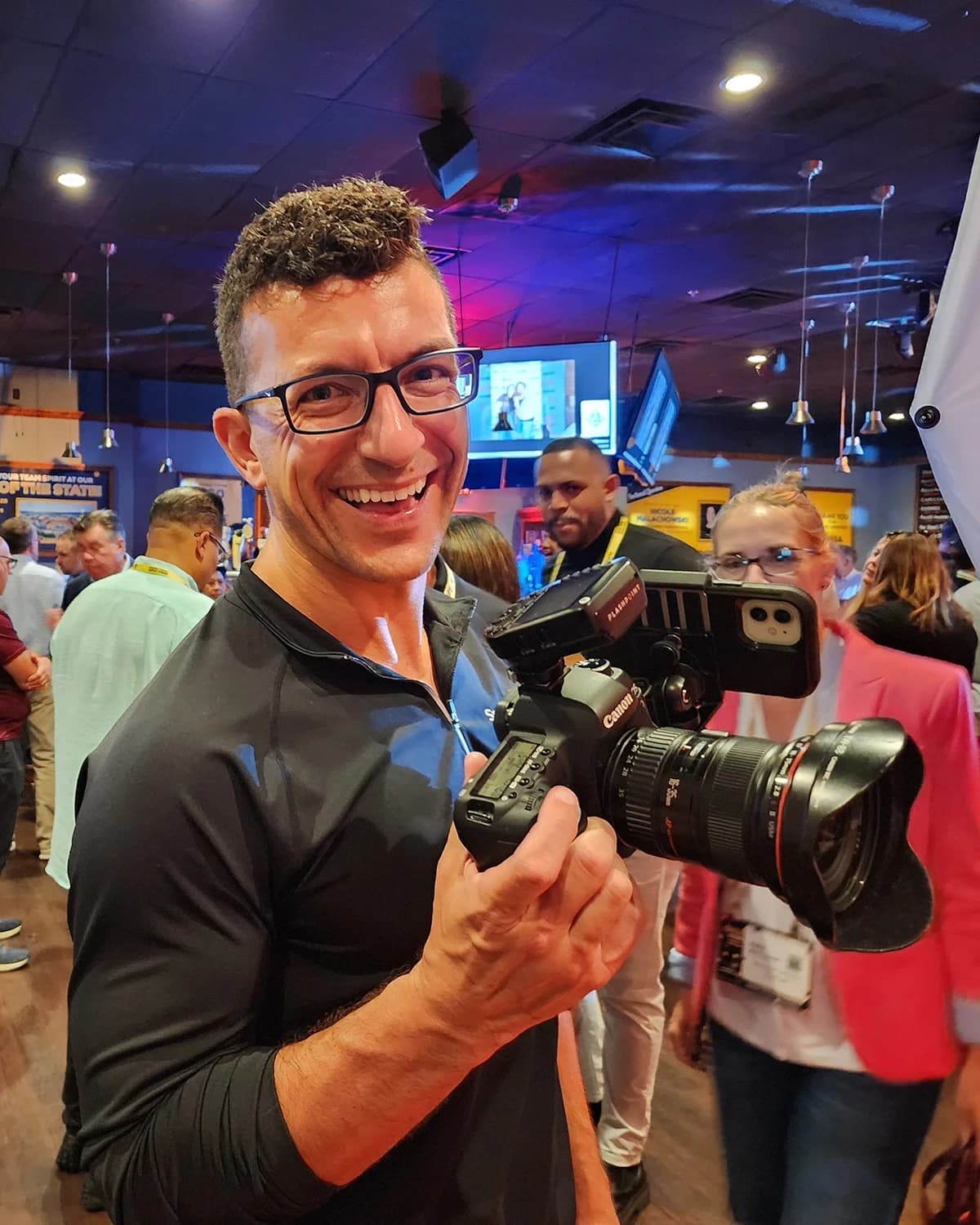 Conference photographer Chad Isaiah capturing event moments