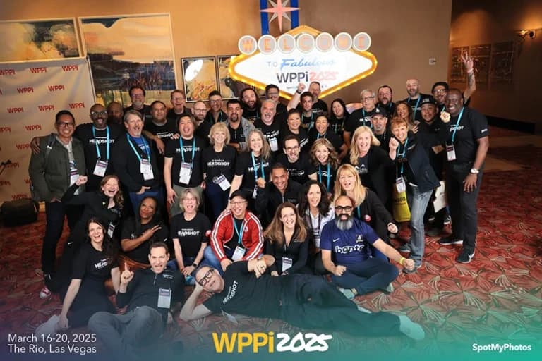 Las Vegas conference step and repeat photography with attendees posing in front of event backdrop