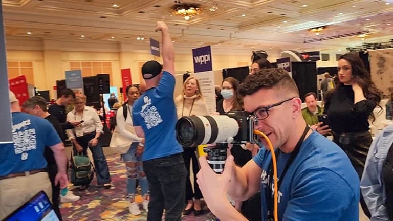 Trade show headshot booth behind the scenes showing professional results