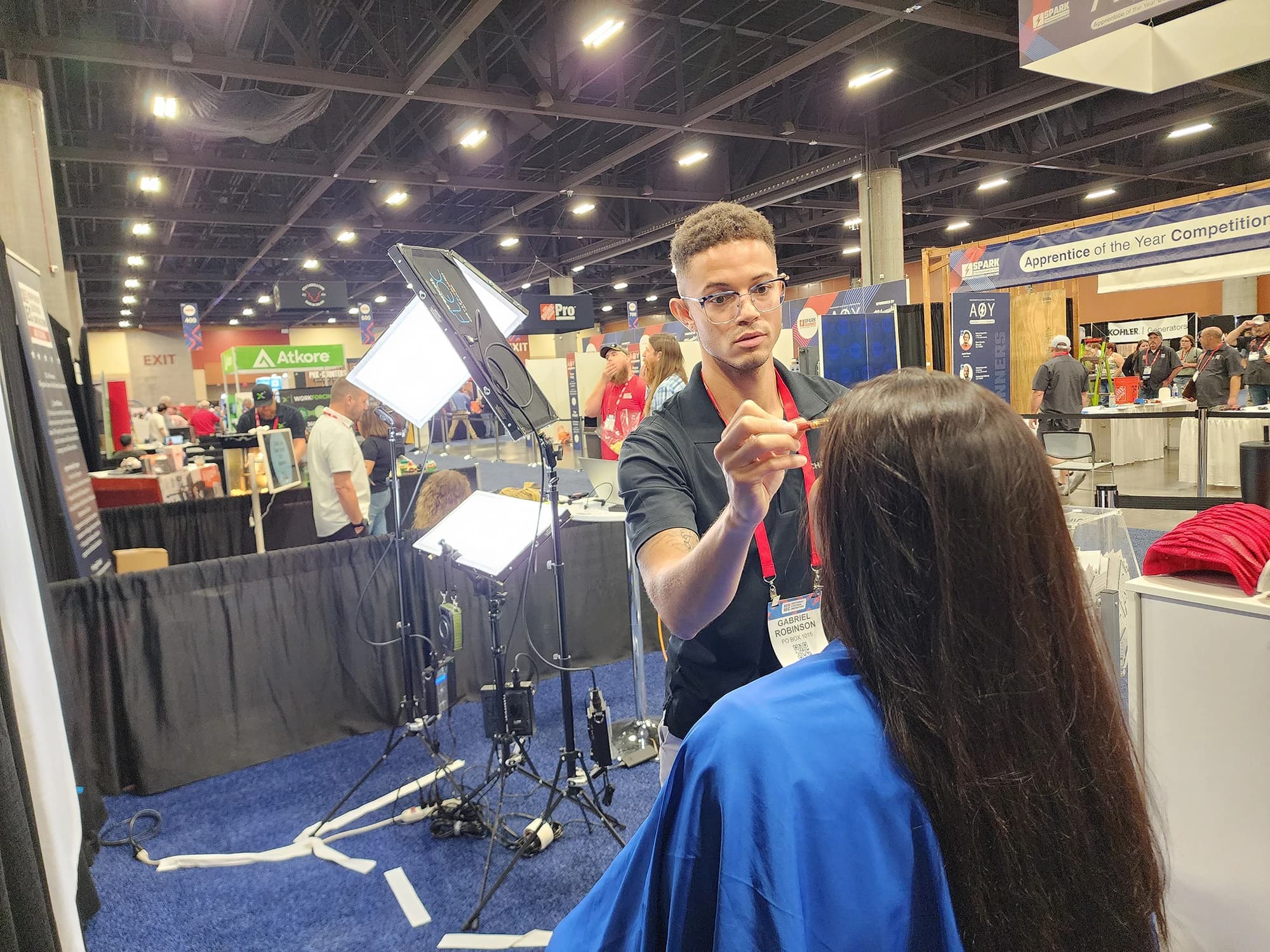 Professional makeup services at conference headshot booth