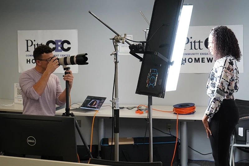 side view of chad isaiah taking headshots at an employher pittsburgh opportunity fair