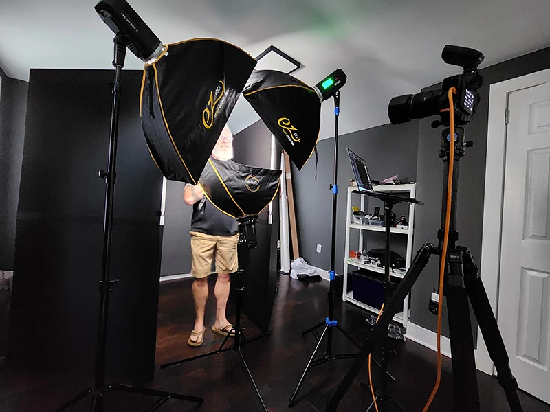 client standing in the lights for a headshot session