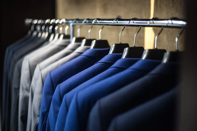 row of suits in a closet for professional headshots