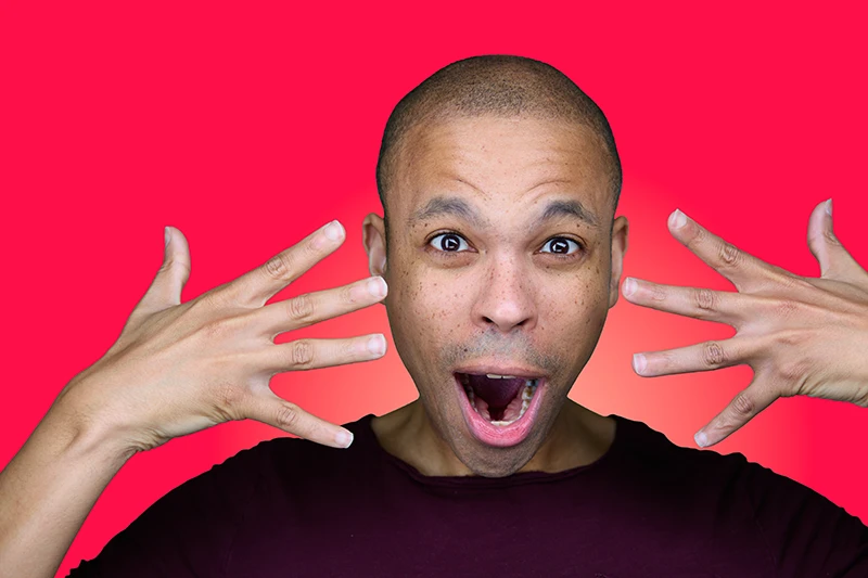 fun headshot of a black man on a red background