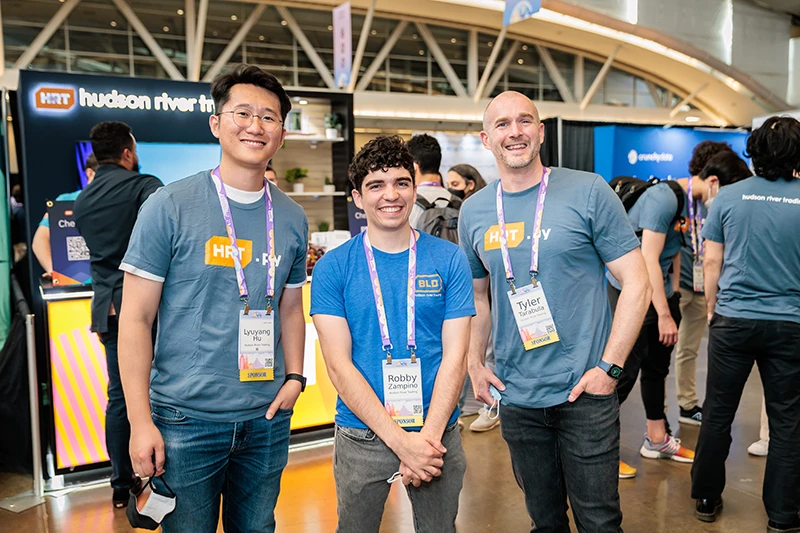 Three smiling convention attendees for Pycon at the David Lawrence Convention Center in Pittsburgh PA