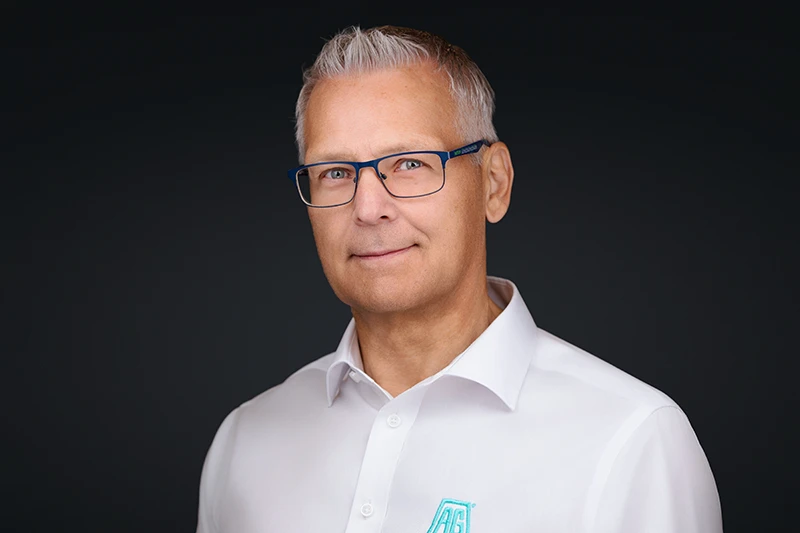 headshot of a male oil and gas professional wearing a white shirt