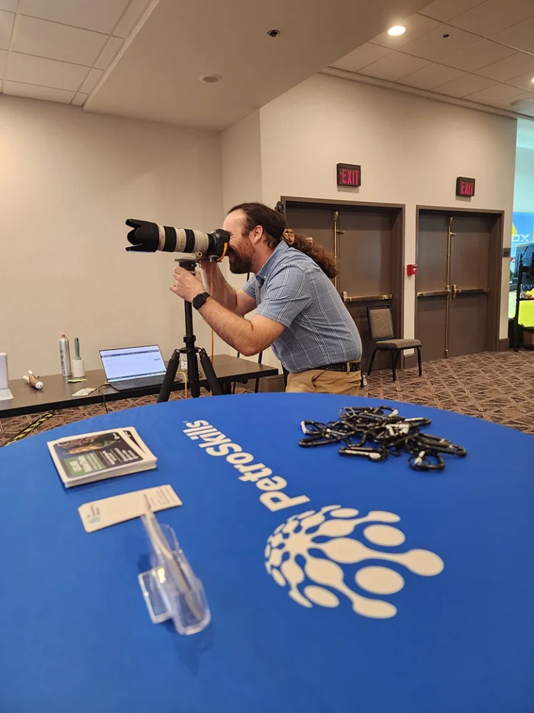 robby owenby photographing at the petroskills headshot booth